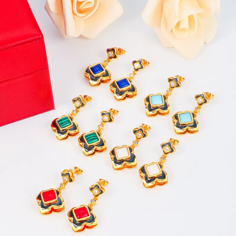 Color-frame pendant sets; gold tone, playful design. Full-frame photograph with existing branding.