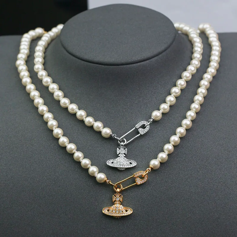 Layered orb strands; mixed tones, pearl accents design. Full-frame photograph with existing branding.
