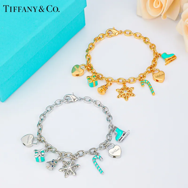 Playful charm bracelet; mixed tones, playful design. Full-frame photograph with existing branding.